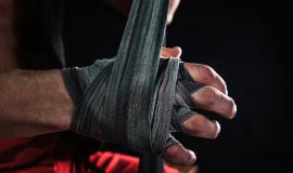 close-up-hand-with-bandage-muscular-man-training-kickboxing-black_155003-16799.jpg