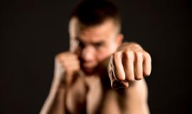 defocused-male-boxer-posing-with-boxing-stance_23-2148615013.jpg
