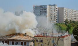 flames-going-out-from-burning-house-neighbourhood-smoke-emerging-from-roof-fire-city-landscape-dangerous-fumes-smog-from-explosion-getting-out-destroyed-building_482257-31524.jpg