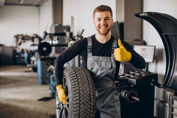 car-mechanic-changing-wheels-car.jpg