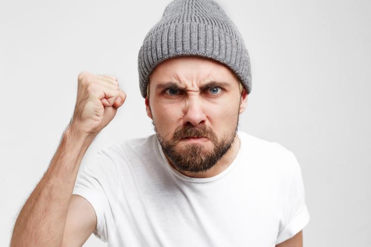 neighbor-standing-in-front-of-door-came-to-argue-angry-with-a-raised-fist-came-to-knock-on-the-door-see-through-the-peephole.jpg