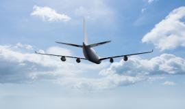 plane-flying-with-clouds-background.jpg