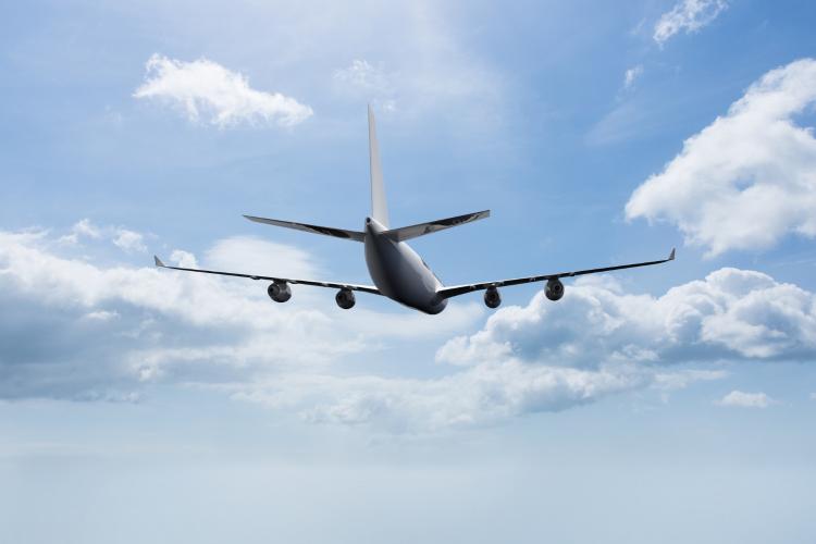 plane-flying-with-clouds-background.jpg