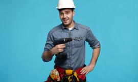 studio-shot-positive-friendly-young-constructor-carrying-drill-belt-with-all-instruments-doing-renovation-client (1).jpg