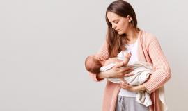 beautiful-dark-haired-mother-with-newborn-baby-in-hands (1).jpg