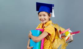 successful-child-with-graduation-cap-and-backpack-full-of-books.jpg