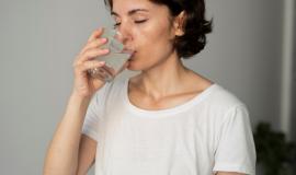 close-up-woman-drinking-water.jpg