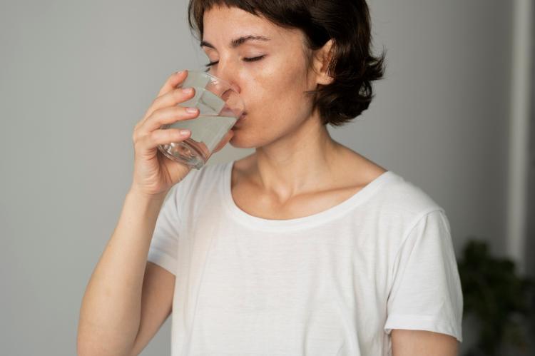 close-up-woman-drinking-water.jpg