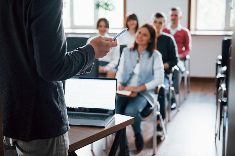 everyone-is-smiling-and-listens-group-of-people-at-business-conference-in-modern-classroom-at-daytime.jpg