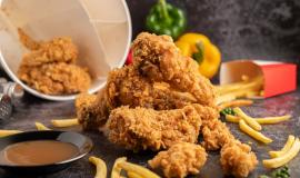 fried-chicken-and-french-fries-on-black-cement-floor.jpg