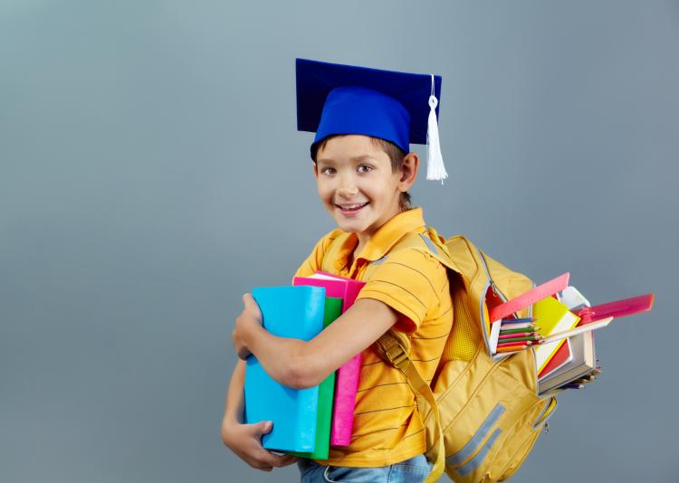 successful-child-with-graduation-cap-and-backpack-full-of-books.jpg