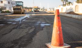 close-up-of-an-orange-traffic-cone-on-the-road-copy-space.jpg