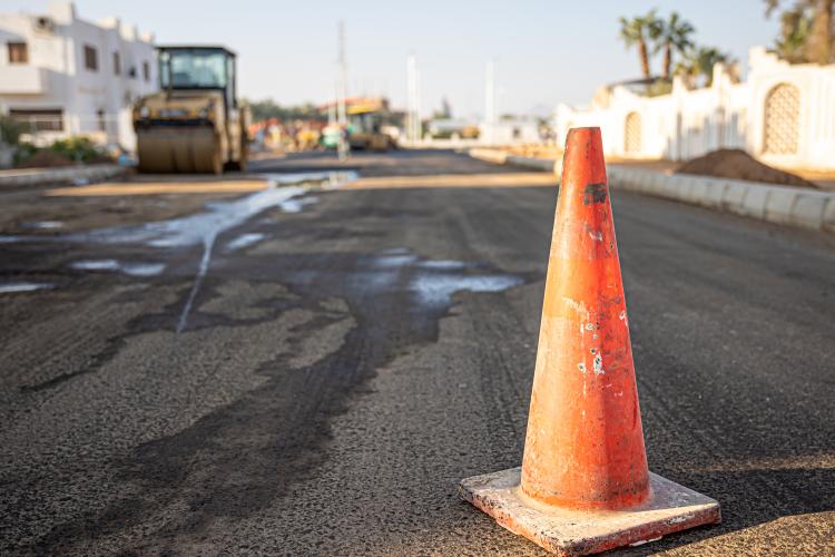 close-up-of-an-orange-traffic-cone-on-the-road-copy-space.jpg