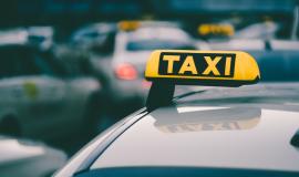 selective-focus-shot-yellow-taxi-sign-traffic-jam_181624-42635.jpg