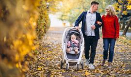 family-with-baby-daugher-walking-in-an-autumn-park.jpg