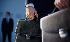 close-up-of-workers-with-briefcases.jpg