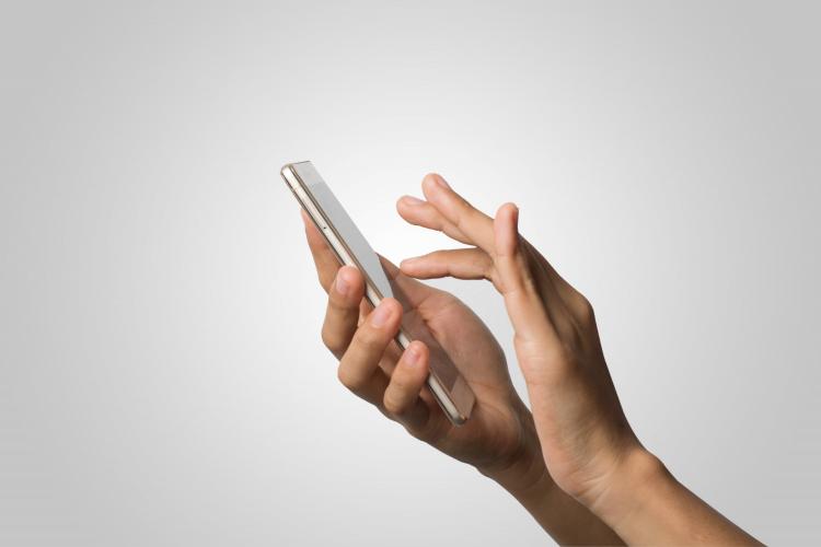 woman-hand-holding-smart-phone-blank-screen-copy-space-hand-holding-smartphone-isolated-on-white-background.jpg