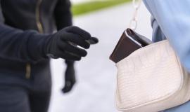 close-up-on-man-preparing-to-steal-from-young-woman.jpg