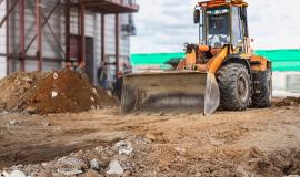 a-powerful-front-loader-on-the-construction-site-performs-sanding-moving-soil-with-construction-equipment-excavation_331695-1920.jpg