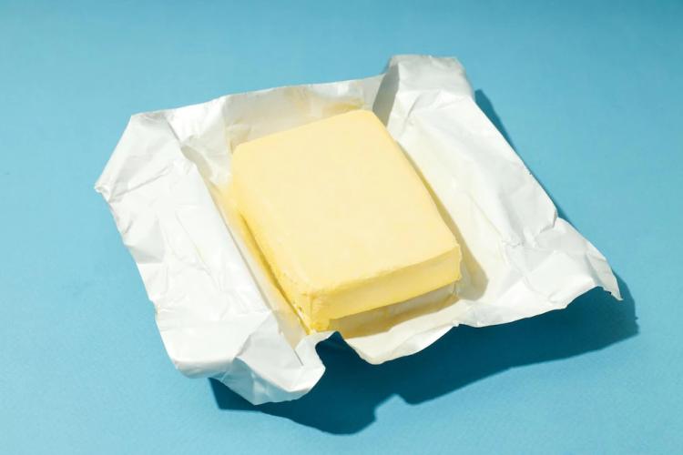 open-package-with-butter-blue-background_185193-89143.jpg