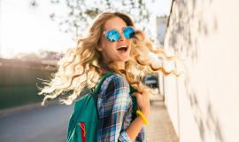 cool-stylish-smiling-happy-blond-woman-walking-street-with-backpack_285396-1627.jpg