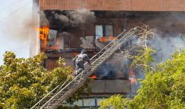 firefighters-extinguish-a-fire-in-a-high-rise-residential-building_110955-67.jpg
