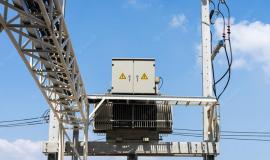 high-voltage-electrical-transformer-on-concrete-pole_44706-1049.jpg