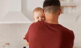 back-view-portrait-young-adult-caucasian-father-holding-son-daughter-cute-baby-looking-camera-mans-shoulder-posing-indoor-with-kitchen-set-background_176532-15592.jpg