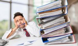 overworked-manager-at-workplace-on-background_488220-48285.jpg