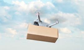 delivery-by-drone-against-background-blue-sky-white-clouds-fast-delivery-goods-by-air-drone-with-cardboard-box_431724-344.jpg