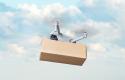 delivery-by-drone-against-background-blue-sky-white-clouds-fast-delivery-goods-by-air-drone-with-cardboard-box_431724-344.jpg