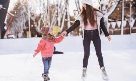 mother-with-daughter-teaching-ice-skating-rink_1303-20084.jpg