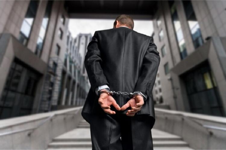 cropped-image-male-hands-handcuffs-his-back_488220-11394.jpg