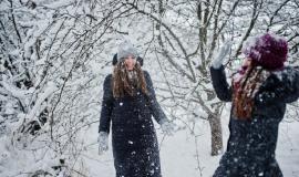 two-funny-girls-friends-having-fun-winter-snowy-day-near-snow-covered-trees_627829-10402.jpg