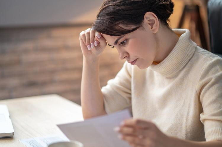 focused-business-lady-leaning-over-a-contract.jpg