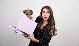 young-woman-with-purple-box-holding-two-big-pinecones_114579-41002.jpg