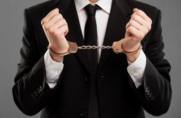 businessman-with-manacles-on-his-hands.jpg