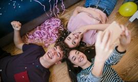 happy-teenagers-taking-selfie-laying-floor_23-2148248782.jpg