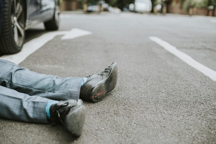 person-lying-on-the-ground-after-a-car-accident.jpg