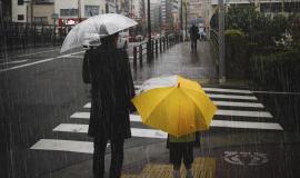 family-crossing-a-road-on-rainy-day.jpg