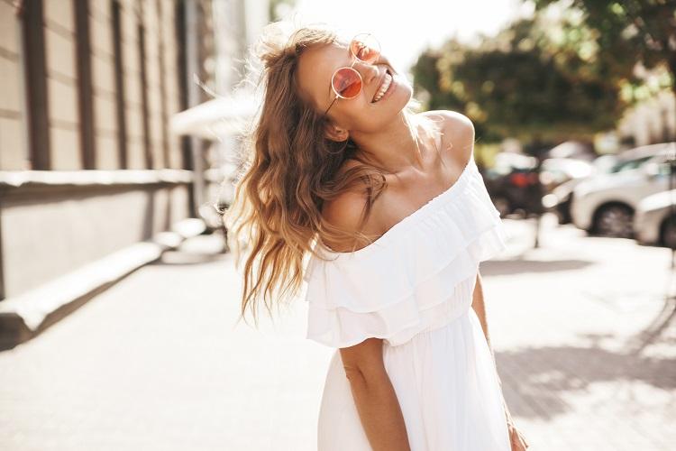 beautiful-cute-smiling-blond-teenager-model-with-no-makeup-in-summer-hipster-white-dress-running-on-the-street-in-sunglasses-turn-around.jpg