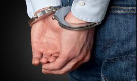 cropped-image-of-male-hands-in-handcuffs-behind-his-back_488220-31242-transformed.jpeg
