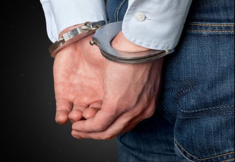 cropped-image-of-male-hands-in-handcuffs-behind-his-back_488220-31242-transformed.jpeg