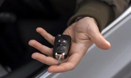 high-angle-hand-holding-car-key.jpg