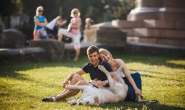 couple-having-fun-in-the-park-with-their-dog.jpg