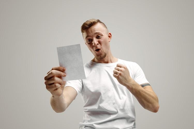 young-caucasian-man-with-a-surprised-happy-expression-won-a-bet-on-gray-studio-background-human-facial-emotions-and-betting-concept.jpg