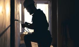 worker-is-cutting-wires-with-lineman-s-pliers.jpg