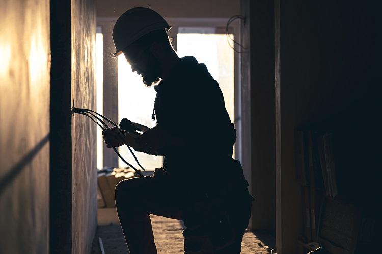 worker-is-cutting-wires-with-lineman-s-pliers.jpg