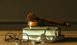 gavel-with-books-on-old-wooden-desk.jpg