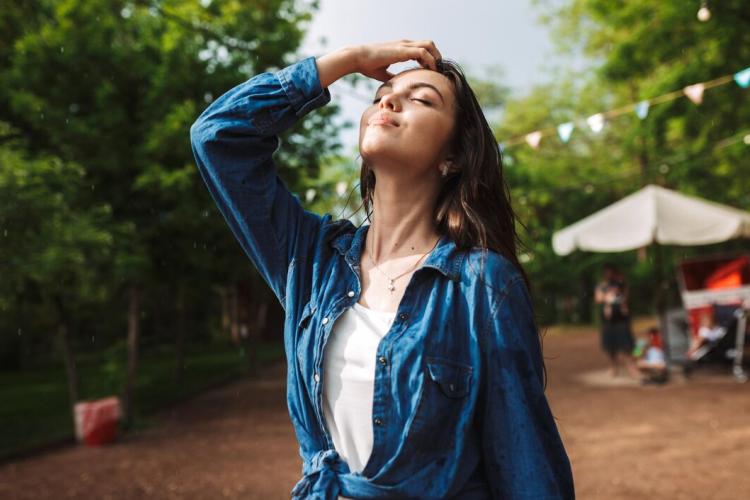 portrait-beautiful-lady-with-wet-hair-denim-shirt-dreamily-closing-her-eyes-while-standing-rain-park_574295-1074.jpg